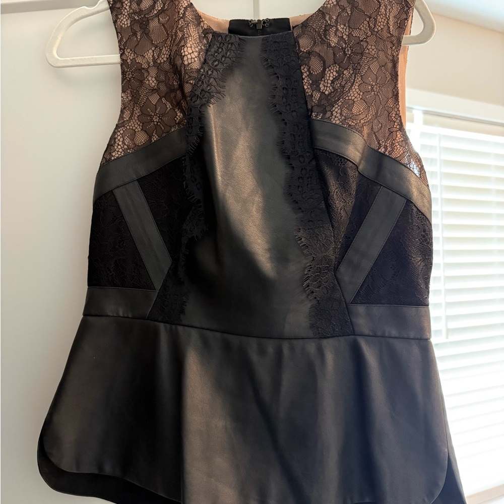 BCBGMaxAzria Black and White Asymmetrical Peplum Blouse